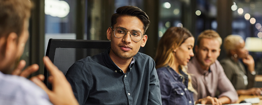 A person listening in a meeting