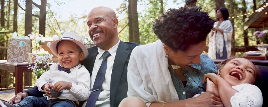 Grandparents laughing with their grandchildren