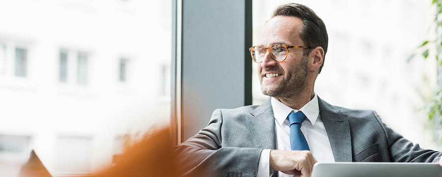 Businessman gazing out the window.