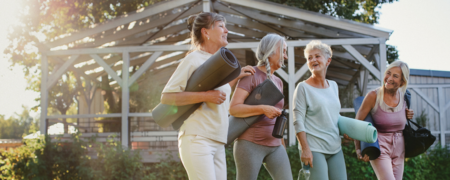 Mature group of ladies leaving a yoga class