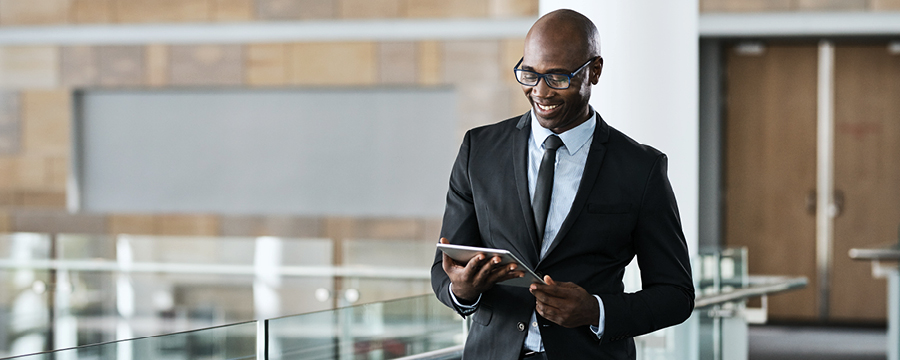 Businessman looking at tablet in the office.