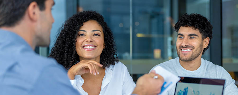 Couple meeting with a financial advisor.